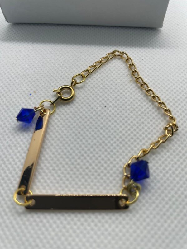 Pulsera en dorada y piedra en cristal azul